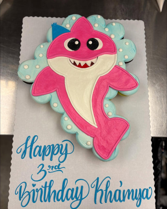 Cupcake birthday cake with pink shark design 