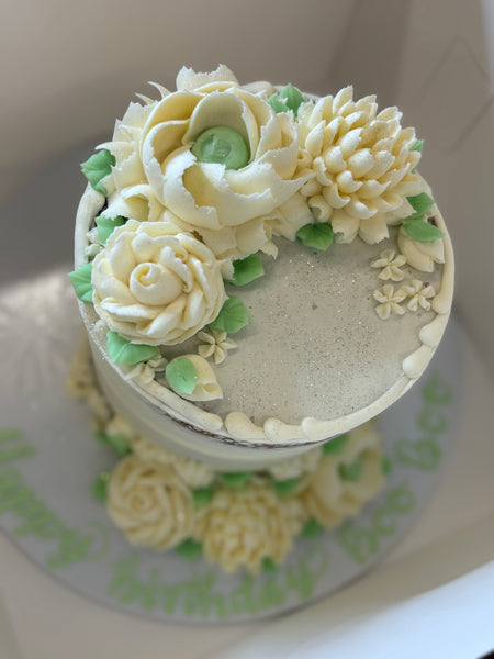 6" 3 tier birthday cake with white and green flowers