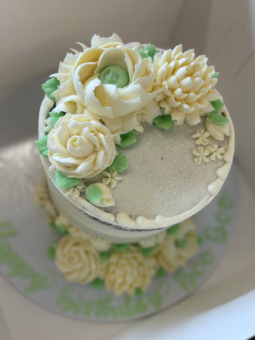 6" 3 tier birthday cake with white and green flowers