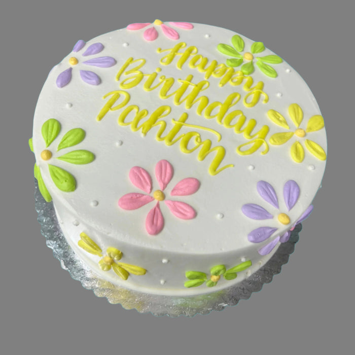Happy Birthday round cake with green, pink, purple and yellow daisies. child or adult birthday