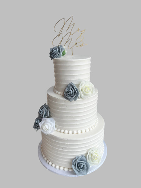3 tier classic wedding cake with gray, white and ivory flowers