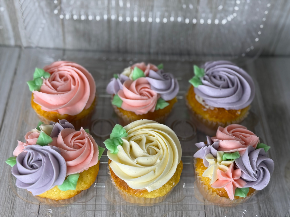 mixed pink violet and white floral cupcakes