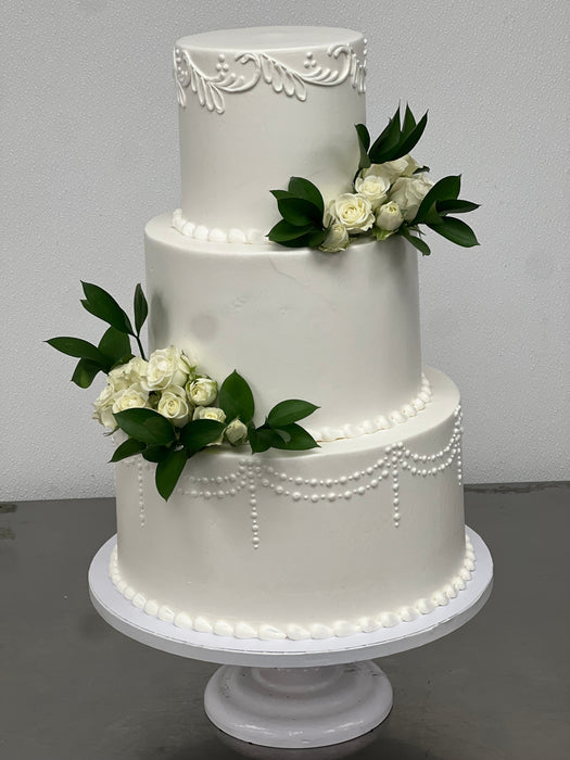 3 tier wedding cake with ivory roses