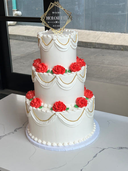 3 tier Wedding cake with swags and red roses